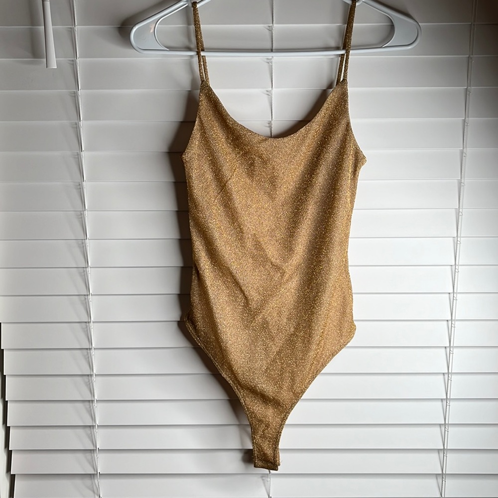 Gold sparkly one piece shirt